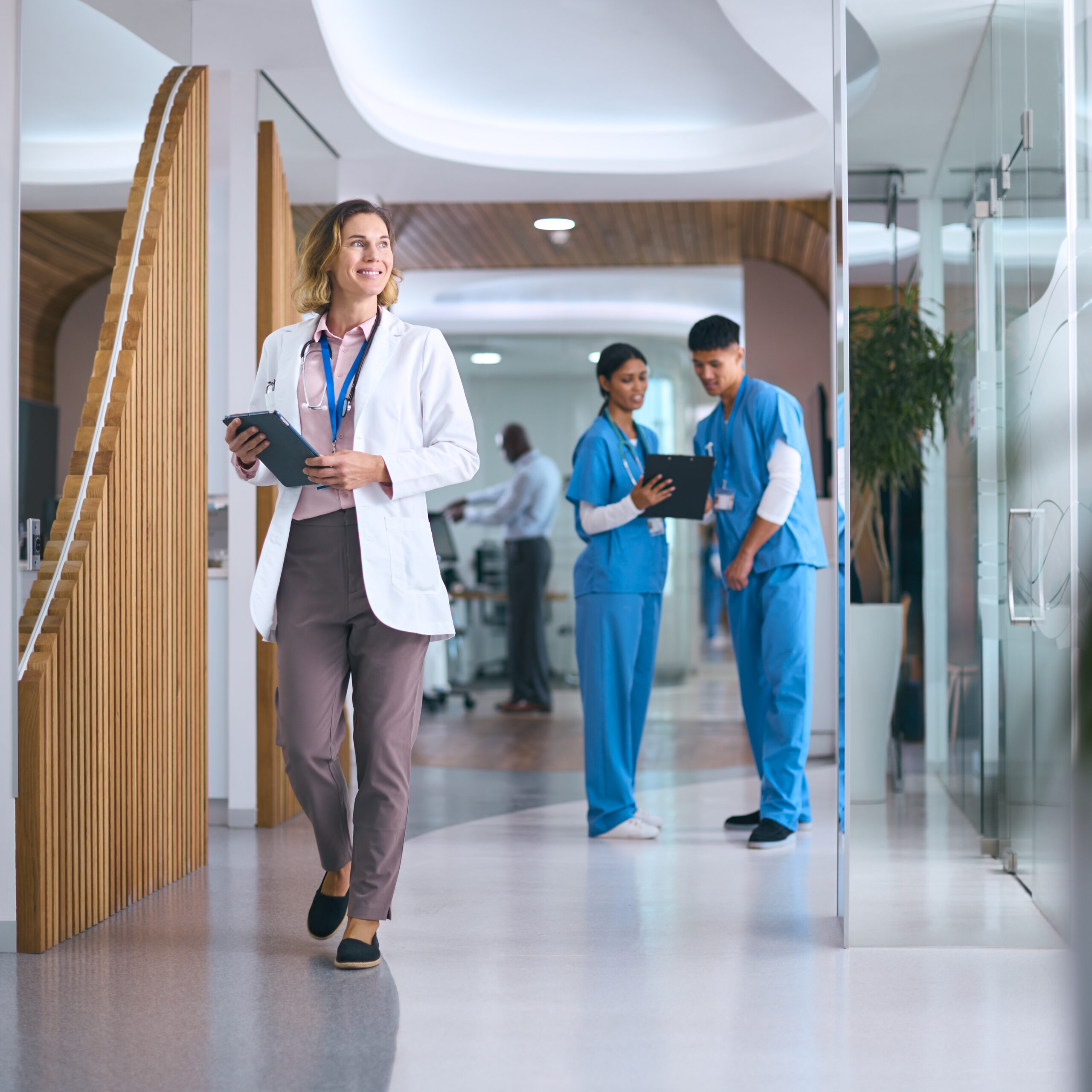 About Us 1 female doctor in white coat with digital tablet in 2024 10 19 03 01 22 utc scaled 1