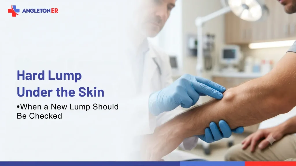 Doctor examines a hard lump under a patient’s skin at Angleton ER to determine when a new lump should be checked.